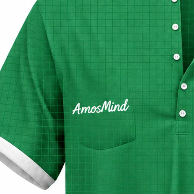 The chest pocket of the green oversized Henley shirt with an AmosMind script above it